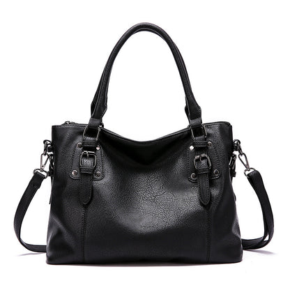 Black PU leather tote bag with dual handles and detachable shoulder strap.