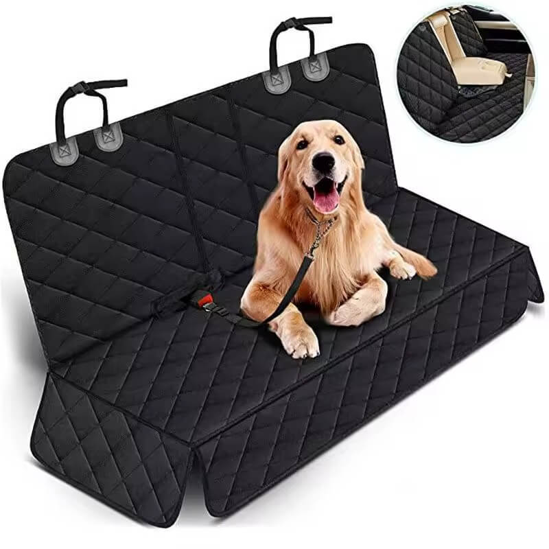 Dog sitting on a black rear seat cover hammock inside a car