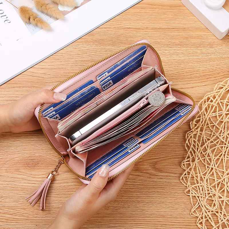 Open long wallet displaying multiple card, cash and coin compartments