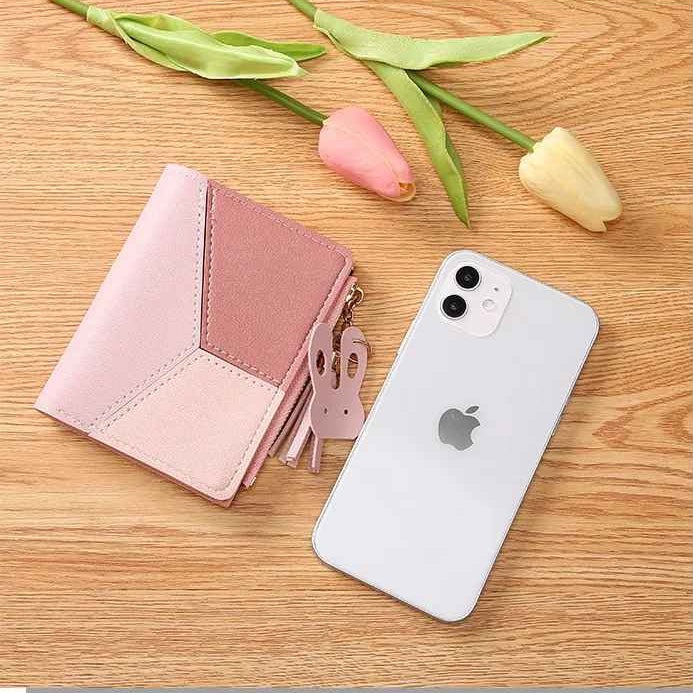 Short patchwork wallet shown beside a smartphone for size comparison