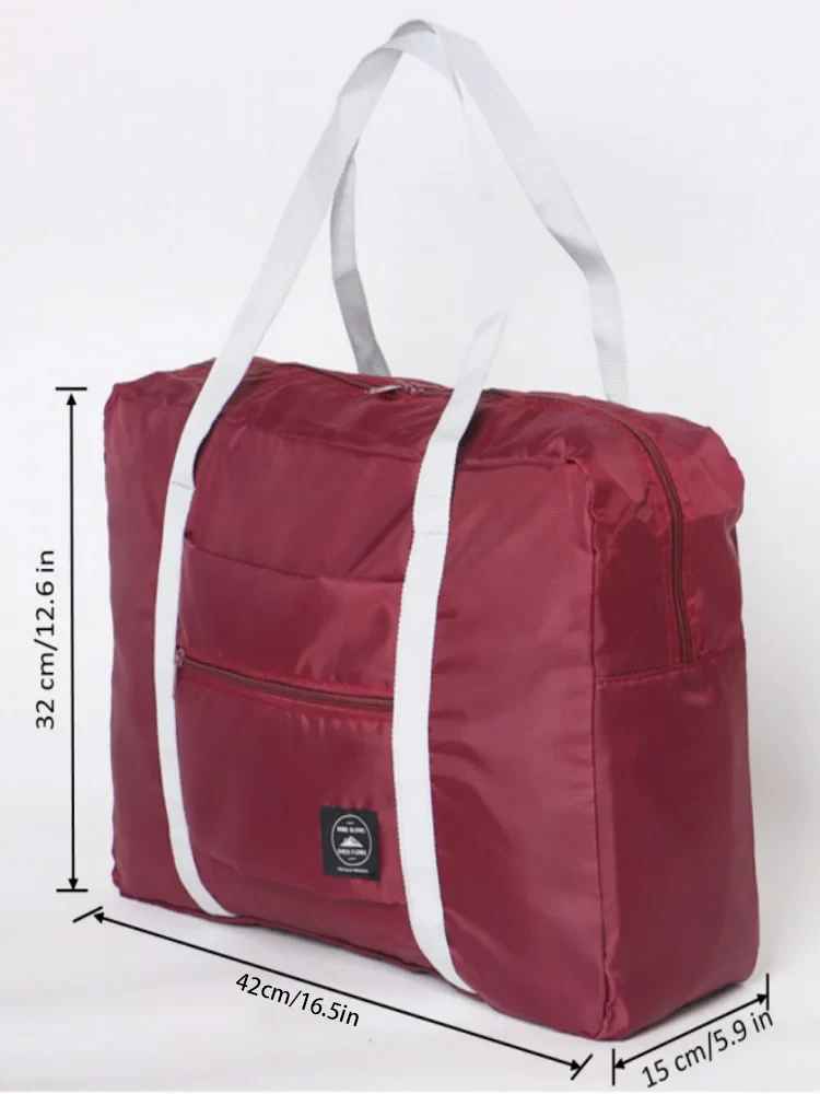 Foldable travel duffel bag displaying dimensions of 46 cm x 14.5 cm x 32 cm.