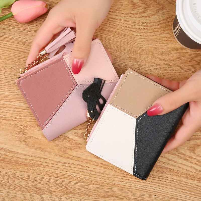 Women's patchwork zip wallet small in pink, and black in hand